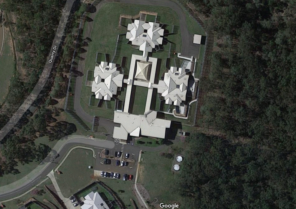 Google Maps Screenshot of Forensic Disability Service Wacol, shows four large buildings joined by covered walkways surrounded by bushland.