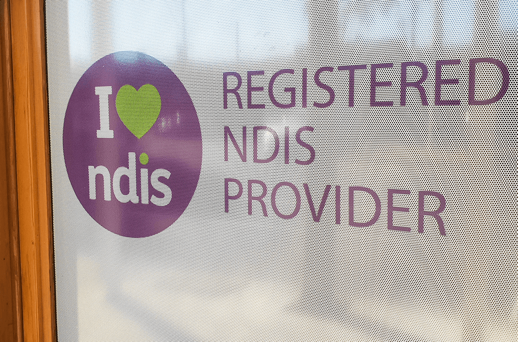 Photo of Registered NDIS Provider sticker on a door